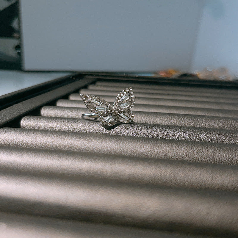 Dignified Fashion Hollow Butterfly Ring in silver, featuring intricate detailing and an adjustable opening, stylish and trendy.