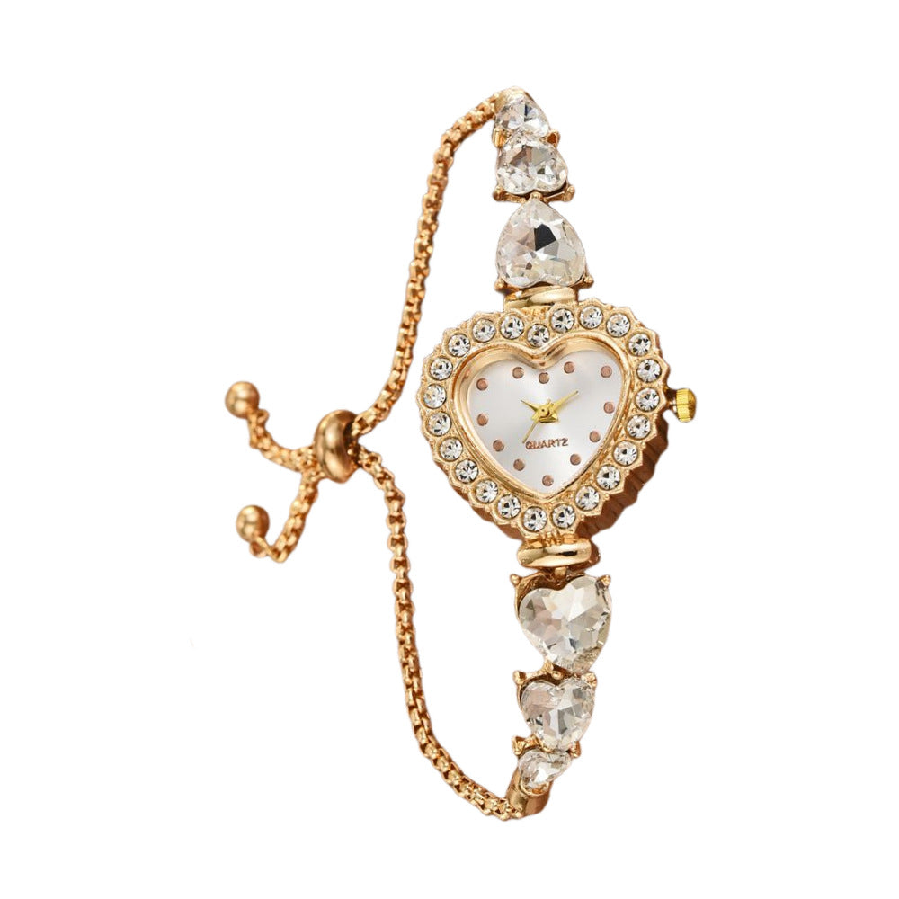 Exquisite heart shape quartz wrist watch with crystal embellishments and gold strap for a feminine touch.