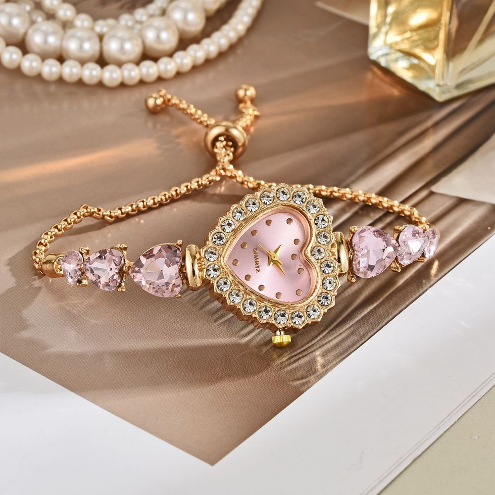 Exquisite heart shape quartz wrist watch with pink face and sparkling stones, feminine and classy jewelry.